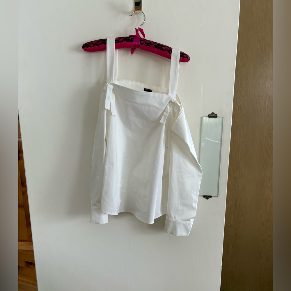 Crisp white cotton open shoulder blouse with tie like detail at straps